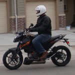 Black Icon Compund Motorcycle Jacket on KTM Duke 690 Supermotard